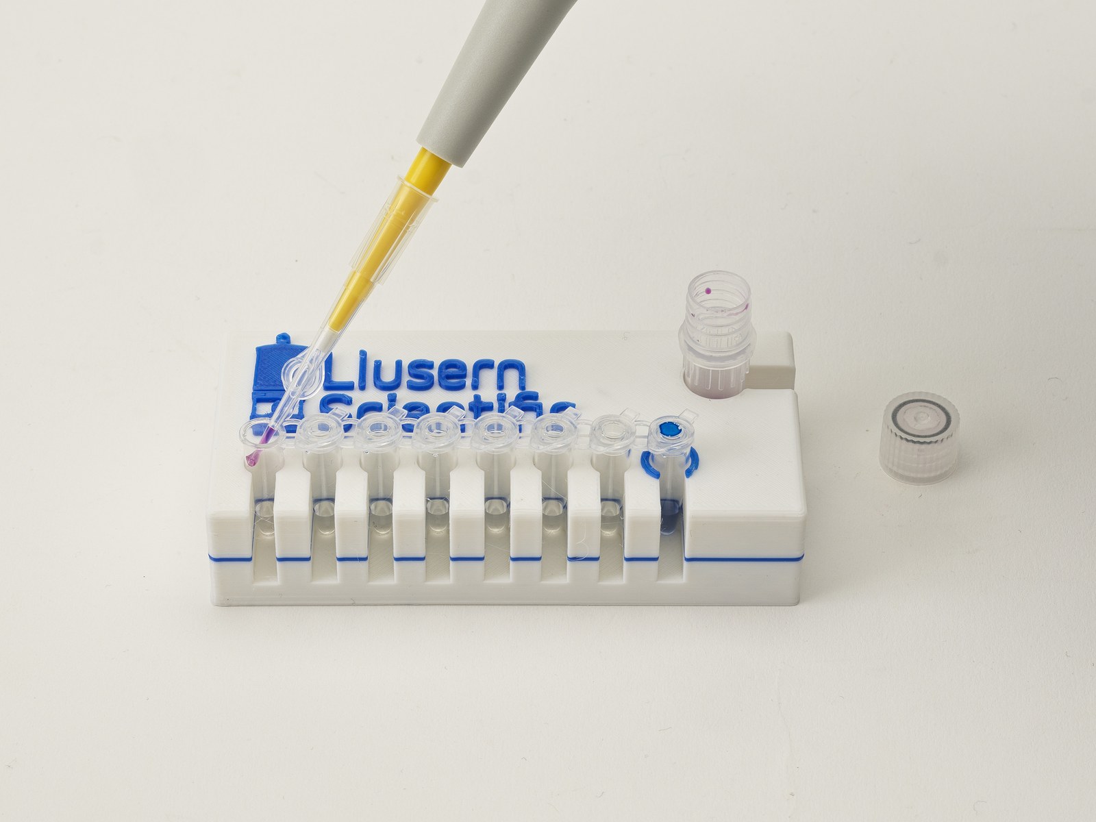 Diluted sample being pipetted into the test strip tubes